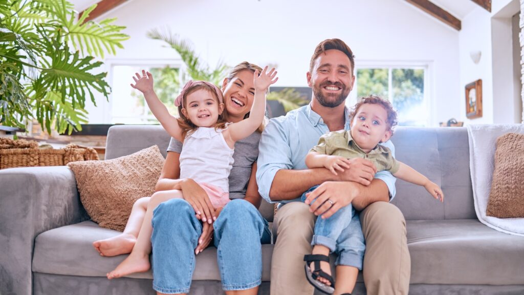 Happy family portrait, parents and kids relax on living room sofa, couch and together for love, car